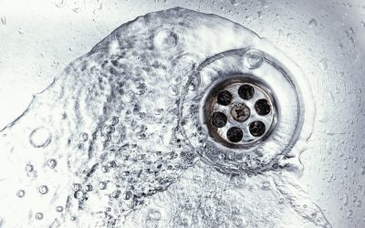 How do you clean a whole house drain?